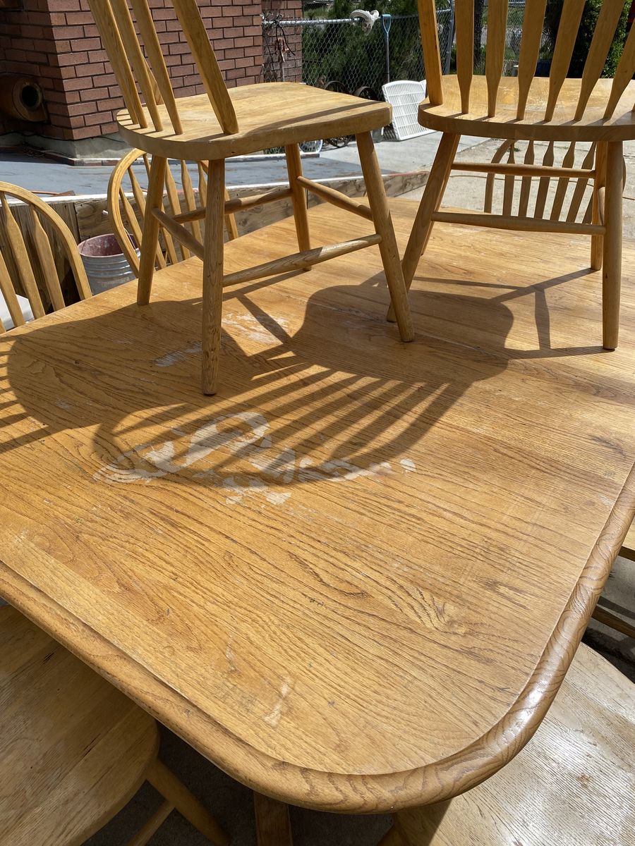 Solid Hardwood Oak table with matching chairs.