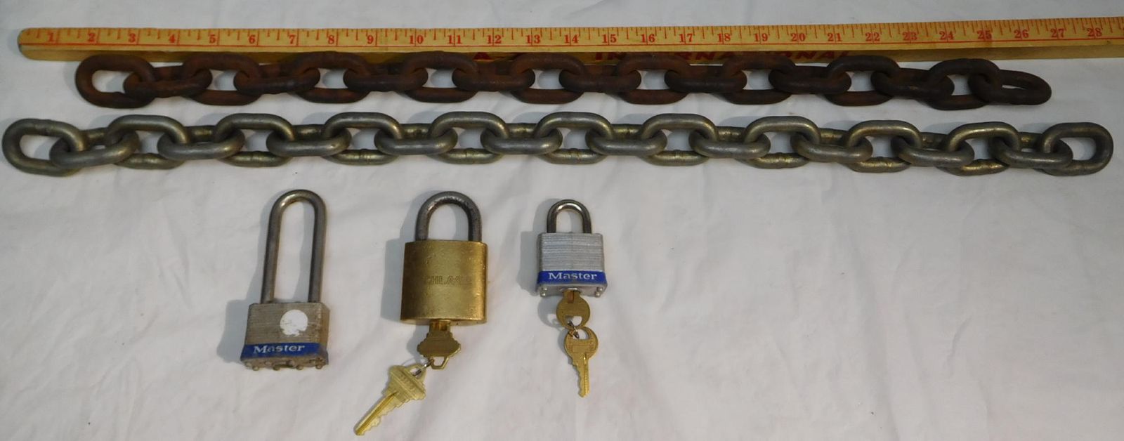THREE LOCKS 2 MASTER & 1 SCHLAGE AMERICAN MADE AND 2 HEAVY 3/8" CHAINS