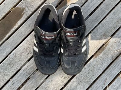 white and black Adidas Sambas