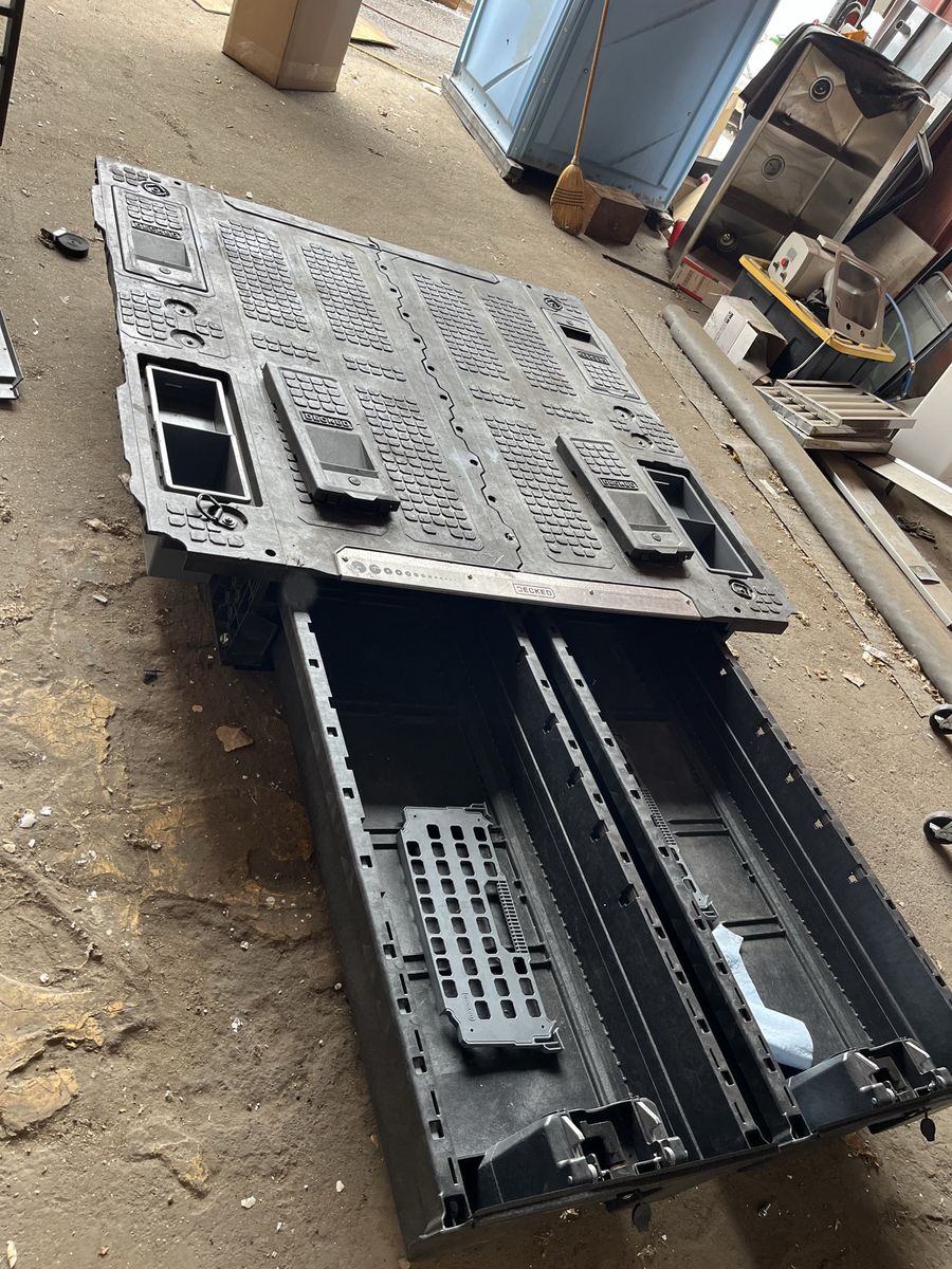 Decked truck bed tool box