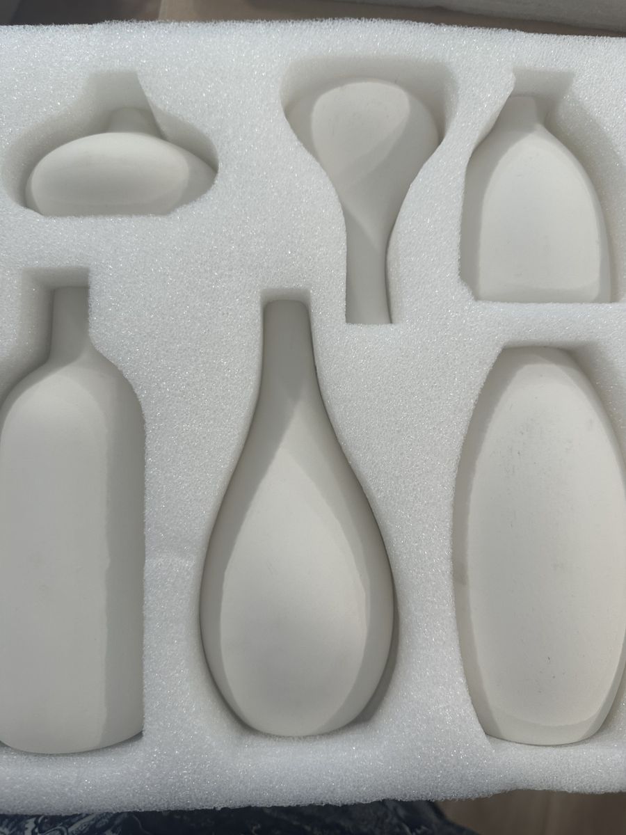 12 Small cream ceramic vases