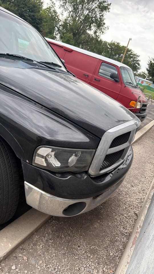 Dodge Ram 1500 Quad Cab Pickup Truck, Black, with Camper Shell