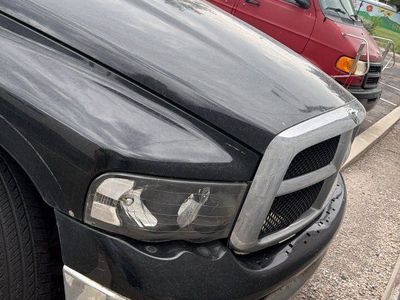 Dodge Ram 1500 Quad Cab Pickup Truck, Black, with Camper Shell