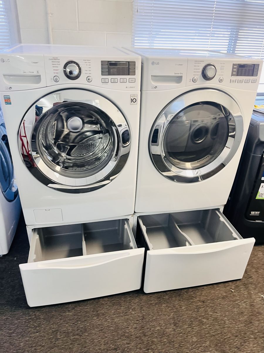 LG washer and dryer set with pedestals