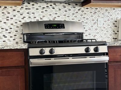 GE Stainless Steel Gas Range Oven & Stove - 30" Wide, 4 Burners, Self-Cleaning, Good Condition