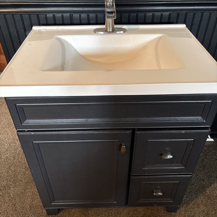 Used vanity, sink, and tap.
