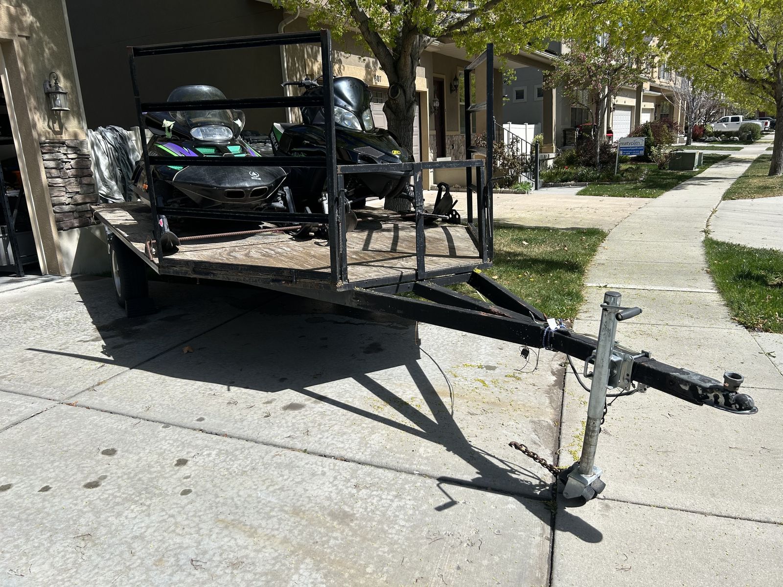 Two snowmobiles and trailer