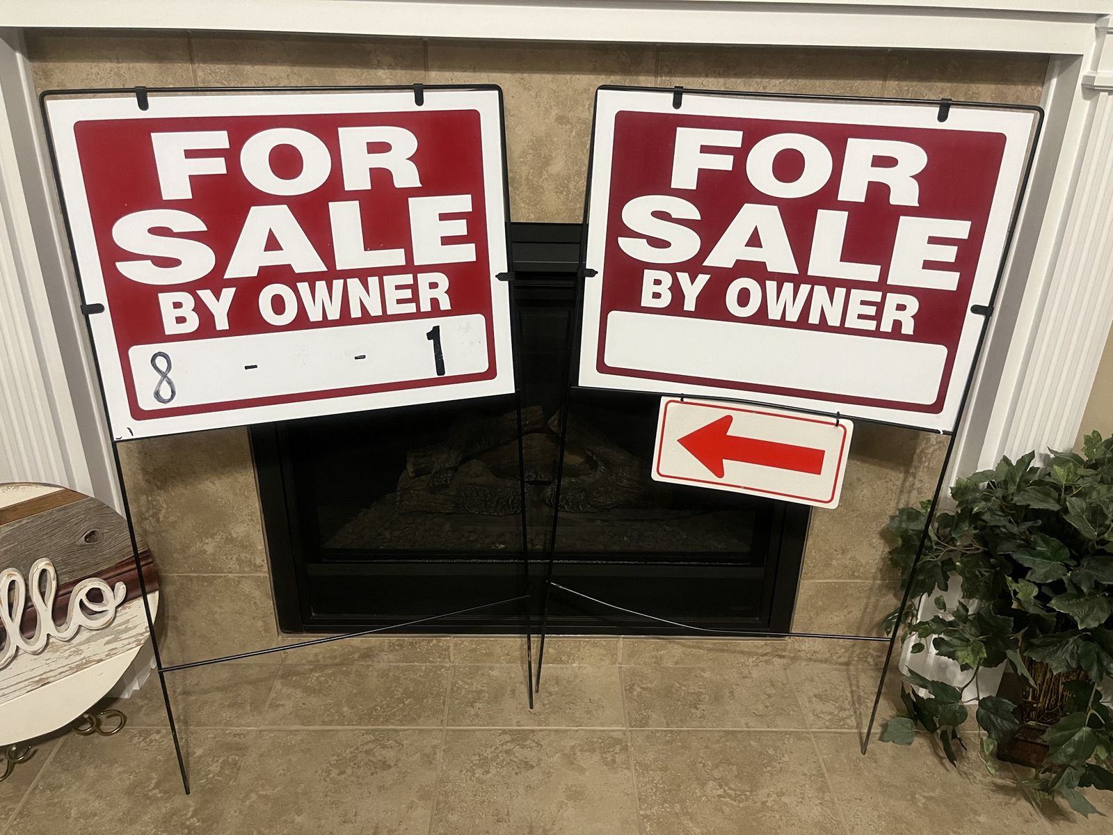 Two for sale by owner signs and stands