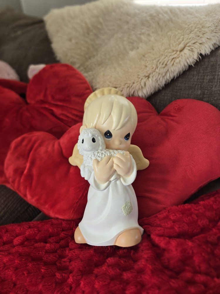Large- 1999 Precious Moments Universal Statuary angel holding a lamb figurine by Samuel J. Butcher