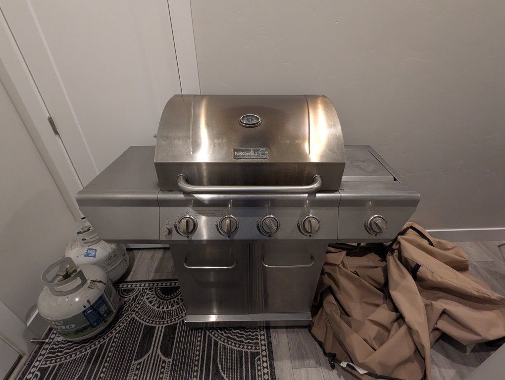 Nexgrill Stainless Steel Propane Gas Grill with 4 Burners + Side Burner + Propane + Fitted Cover