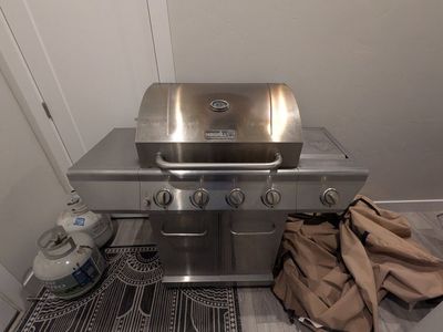 Nexgrill Stainless Steel Propane Gas Grill with 4 Burners + Side Burner + Propane + Fitted Cover