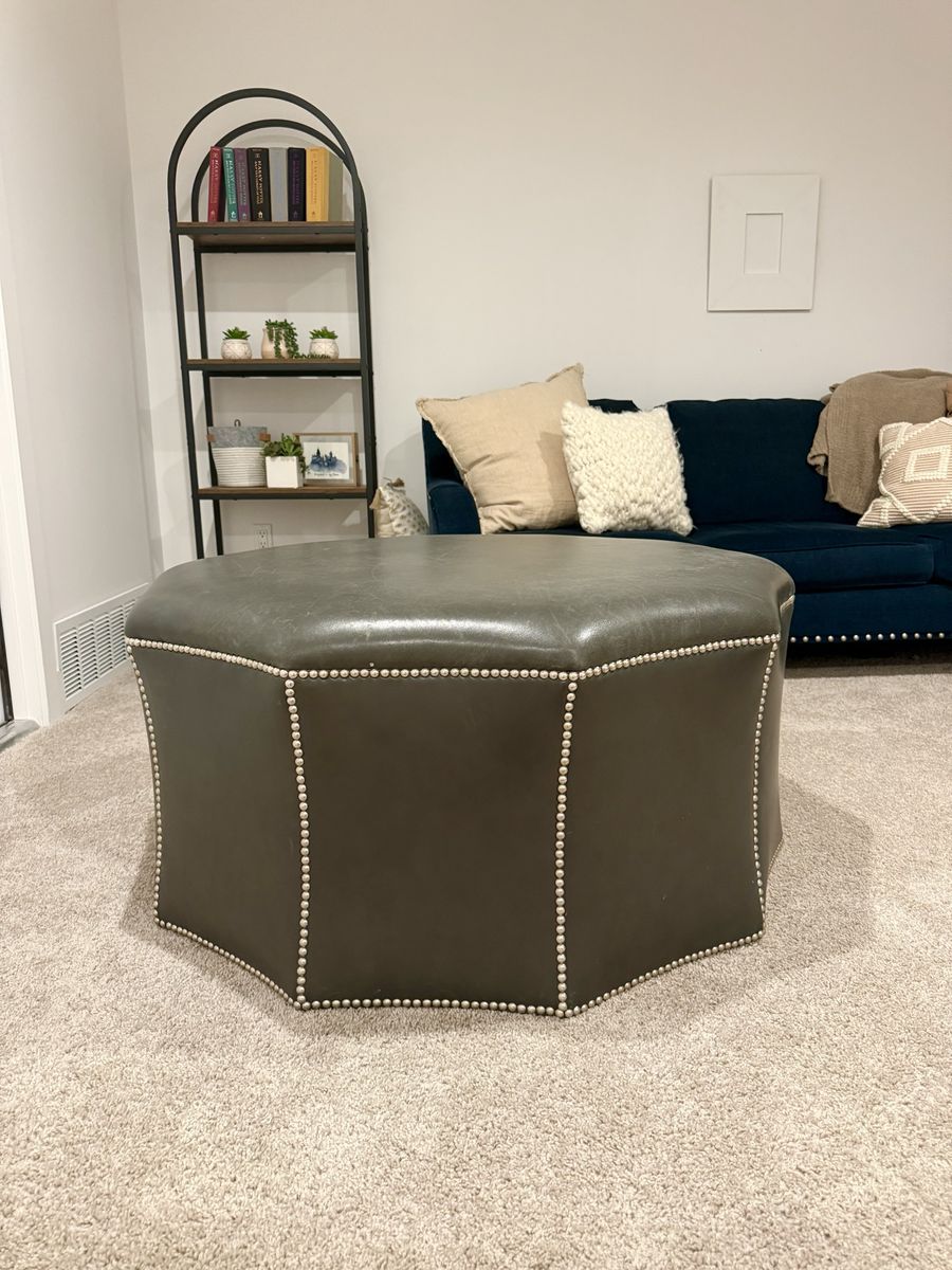 Leather ottoman with nailhead