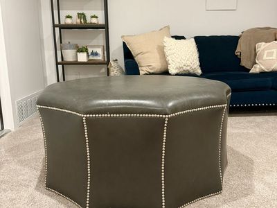 Leather ottoman with nailhead