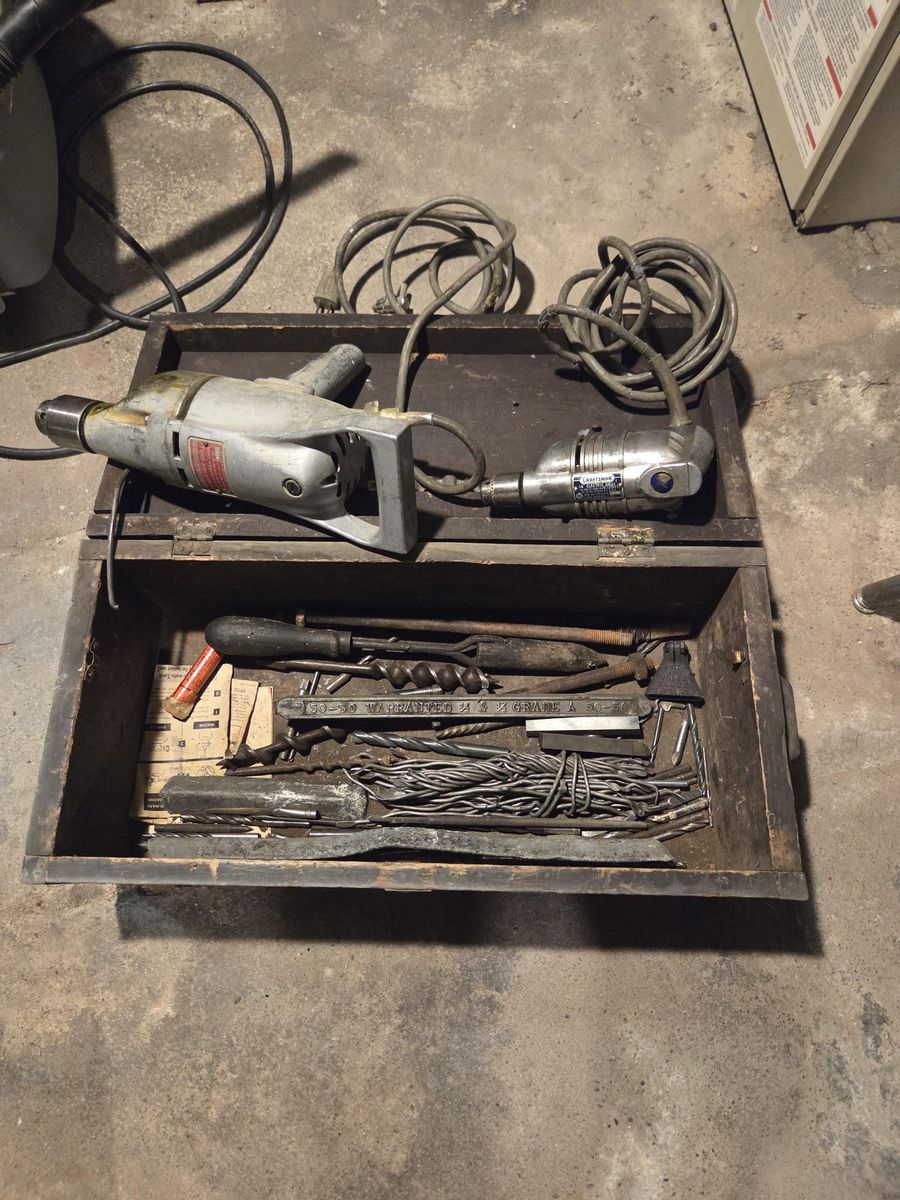 Old electric drills and miscellaneous items in old tool box