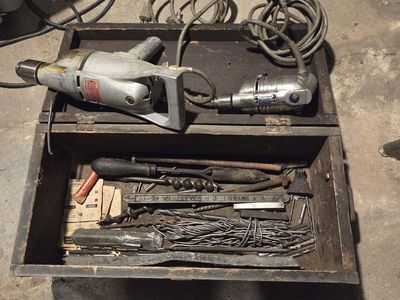 Old electric drills and miscellaneous items in old tool box