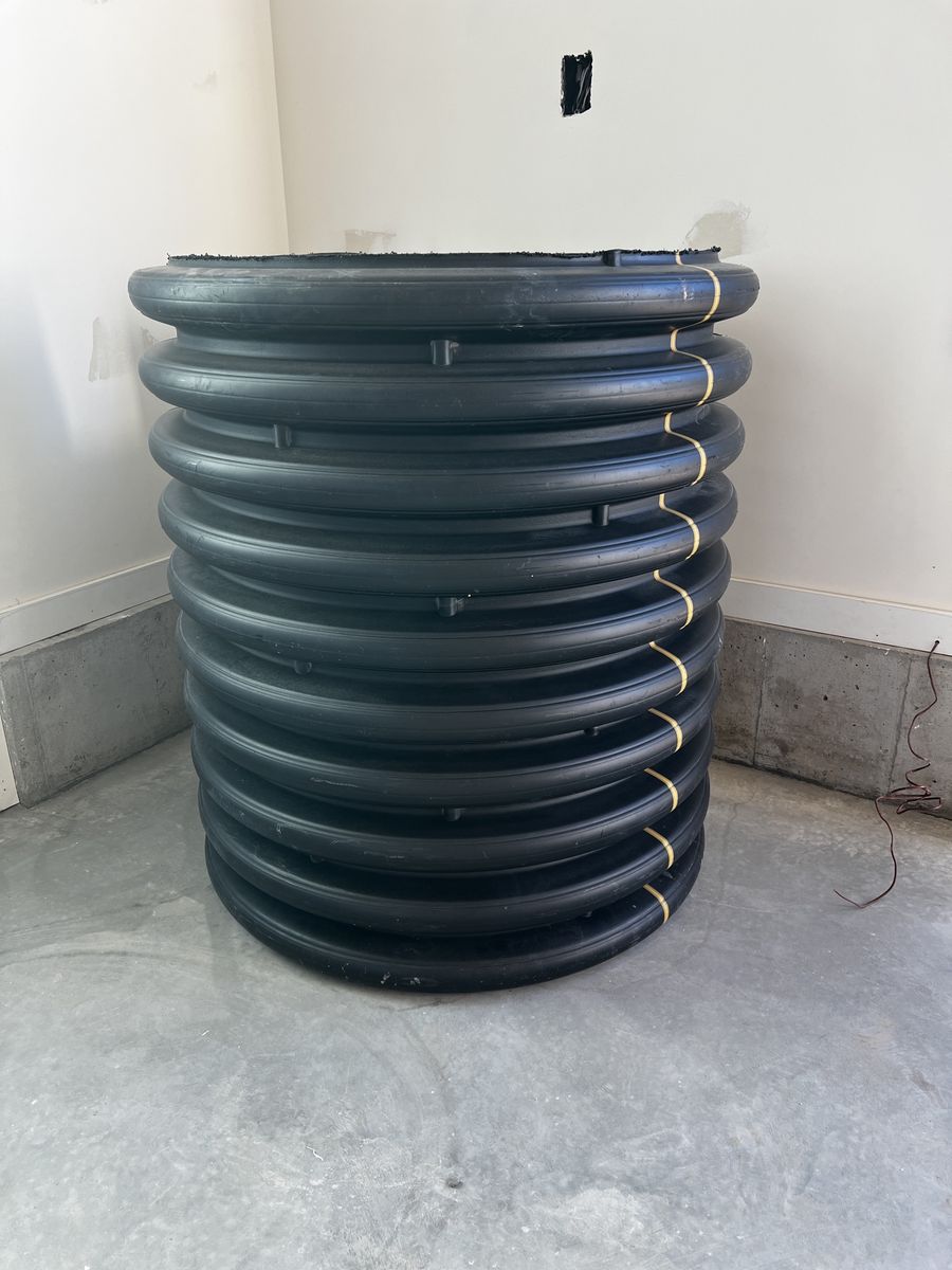 Black Corrugated Plastic Drainage Pipe / Culvert Section, Approximately 30-inch Diameter