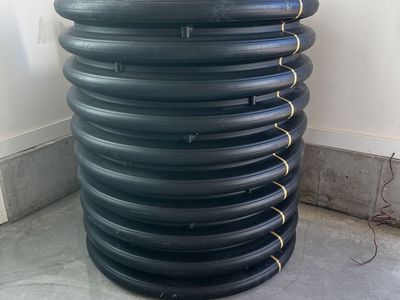 Black Corrugated Plastic Drainage Pipe / Culvert Section, Approximately 30-inch Diameter