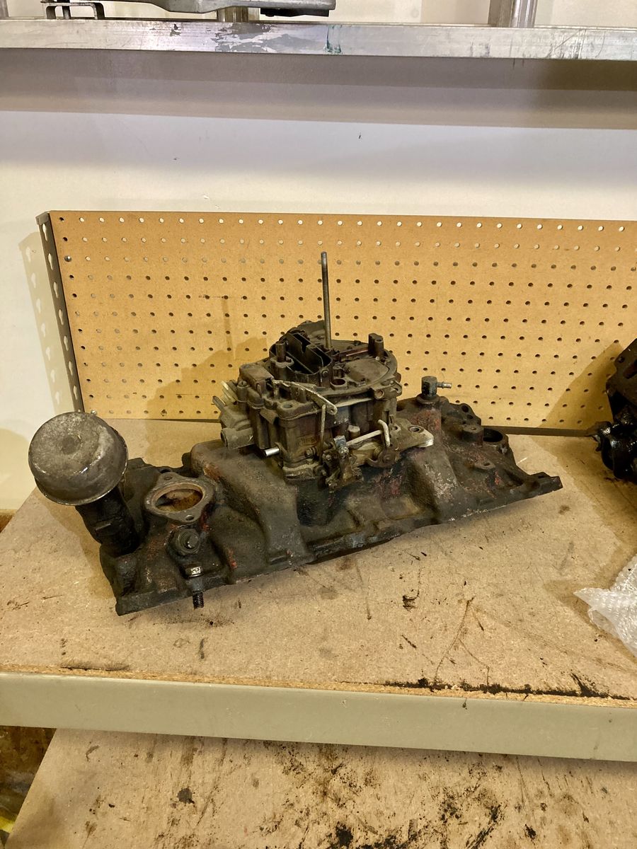 Chevy manifold and carburetor 1960s