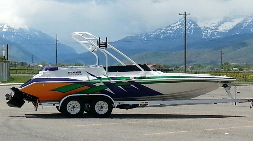 Sleek Craft Power Boat with Wakeboard Tower and Tandem Axle Trailer