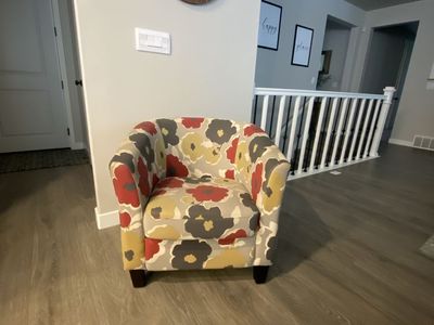 Upholstered Tub-Style Chair with bold floral design