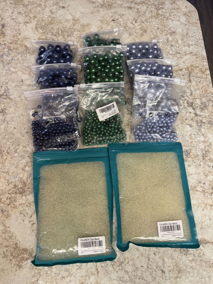Water beads and solid marbles, vase fillers