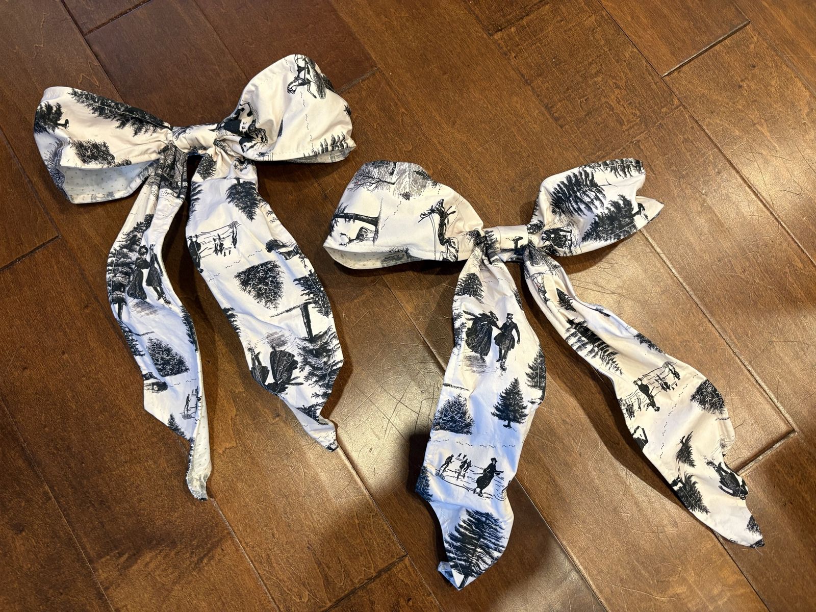 2 New Large Clip On Bows w/ Old-Fashioned Ice Skating Scenes