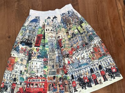 Skirt brand NEW with tags London England size XS (2) waist 13.5 elastic on back.