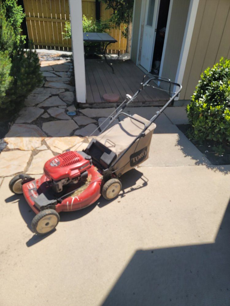 Red Toro Walk-Behind Gas Powered Push Lawn Mower with Grass Catcher