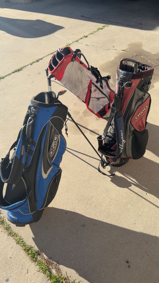 OGIO GOLF BAGS AND 2 golf clubs wedges