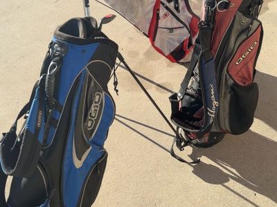 OGIO GOLF BAGS AND 2 golf clubs wedges