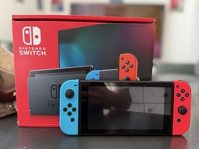 Nintendo Switch Console with Neon Blue and Red Joy-Con Controllers