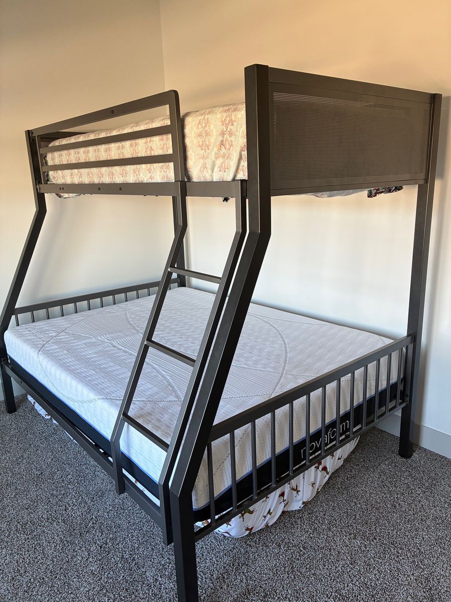 Heavy duty metal bunk bed with twin over full.  Bed and brand new mattress (novaform)