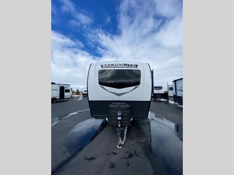 New 2025 Forest River RV Flagstaff Micro Lite Couples Travel Trailer w/Fireplace and 67" Theater Seats(25BSDS)