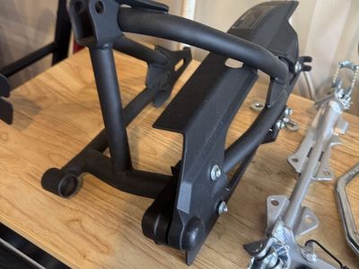 CRF110 Rear Swingarm new/ cerakoted with Guard and bolts new never used “off new bike”