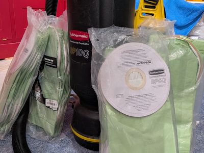 Backpack vacuum (backpack vac) works well and comes with a ton of bags Rubbermaid BP10Q