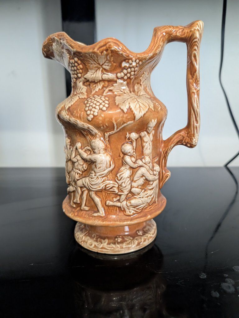 Vintage Ceramic Pitcher with Relief Figural and Grape Vine Design