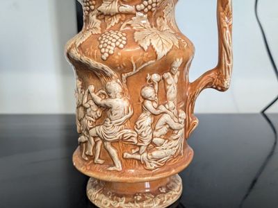 Vintage Ceramic Pitcher with Relief Figural and Grape Vine Design