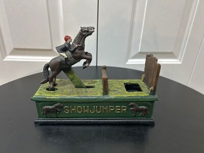 Vintage Cast Iron Show Jumper Coin Bank