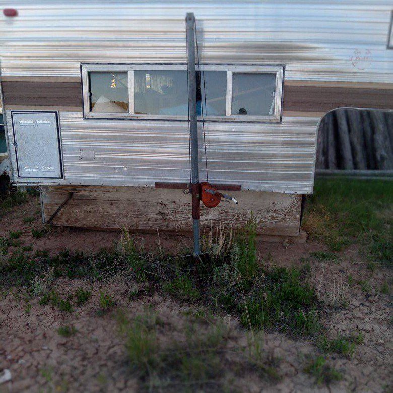 Eight foot cabover camper.