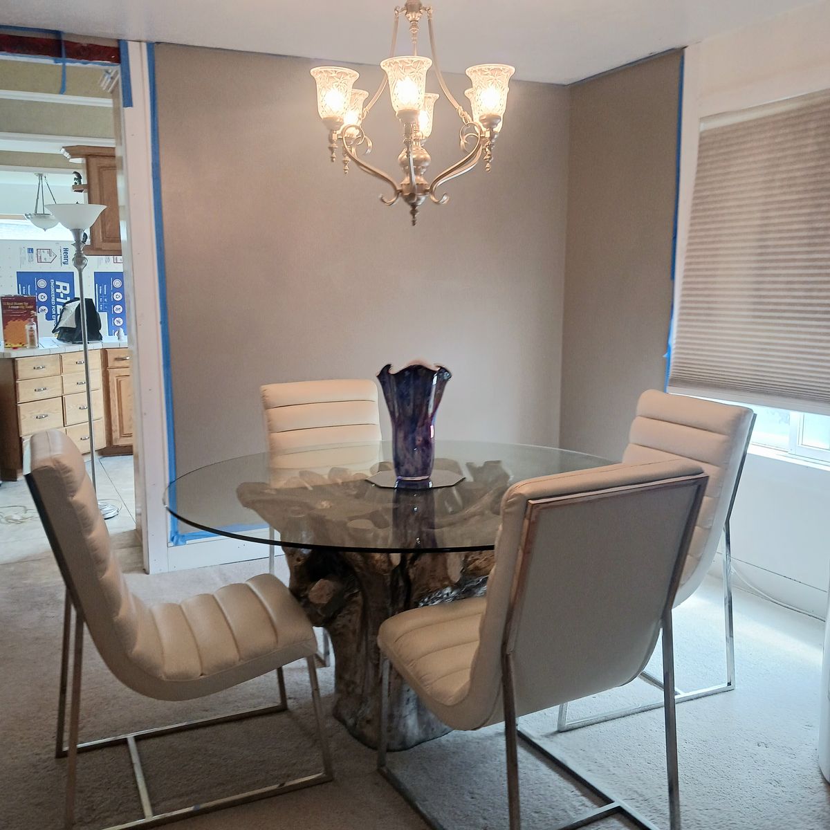 Glass Dining Table with White Leather Chairs