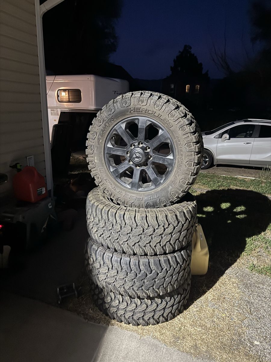 8x6.5 Ram midnight wheels and tires