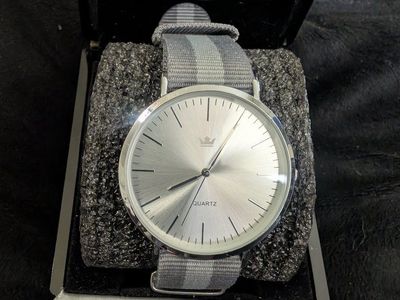 Quartz Analog Wristwatch with Silver Dial and Grey Striped Fabric Strap