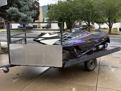 Vintage 1996 Polaris XLT and 1974 Raider snowmobiles with Trailer.