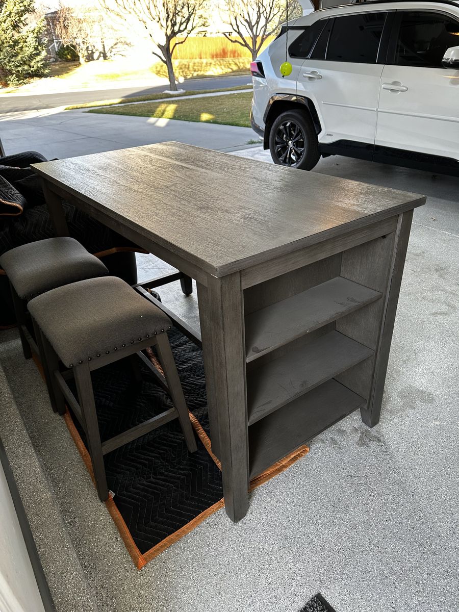 Caitbrook Counter Height Dining Table with shelves