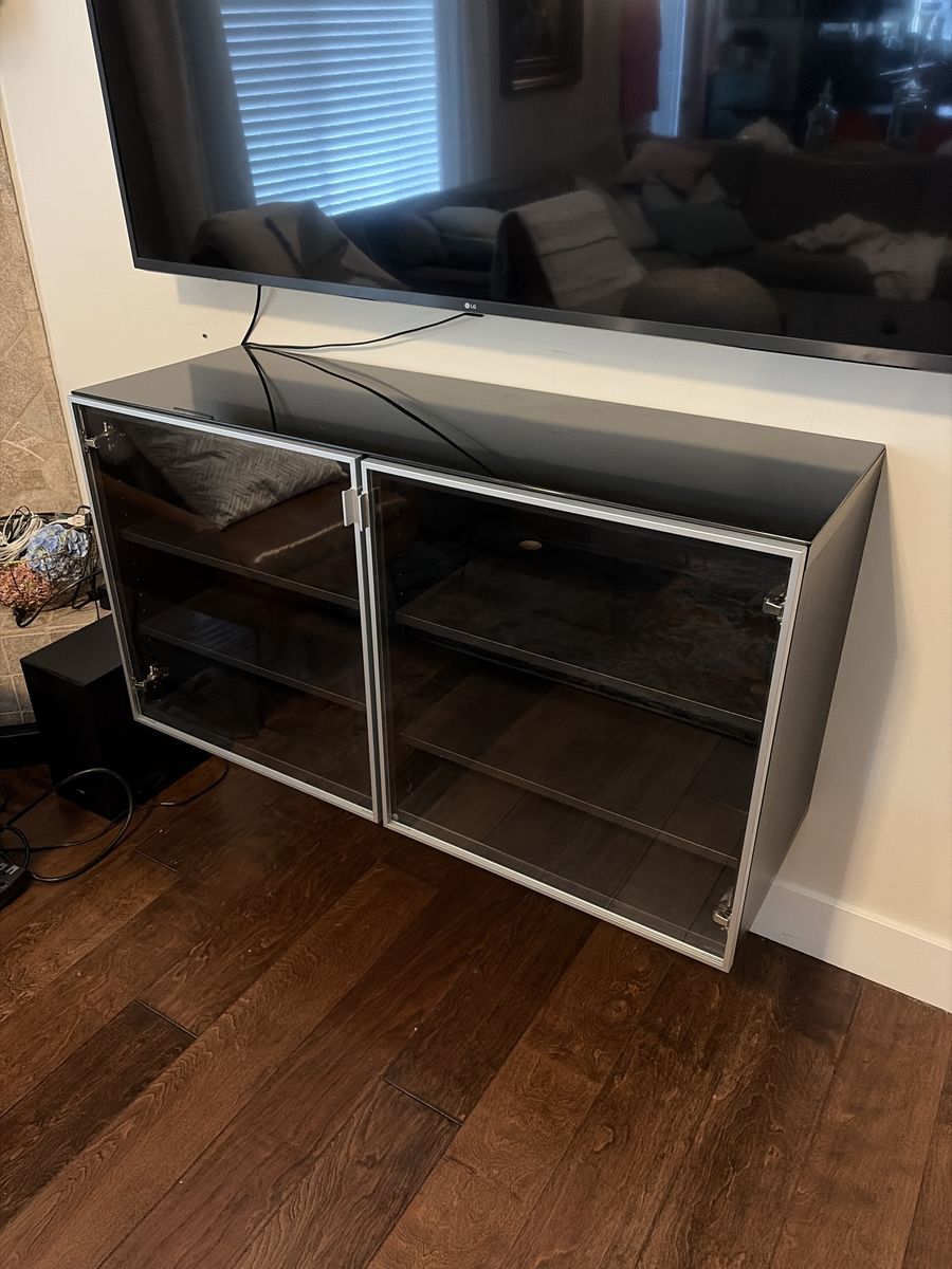 Sleek Black Glass-Top Wall-Mounted Media Cabinet with Double Doors and Adjustable Shelves