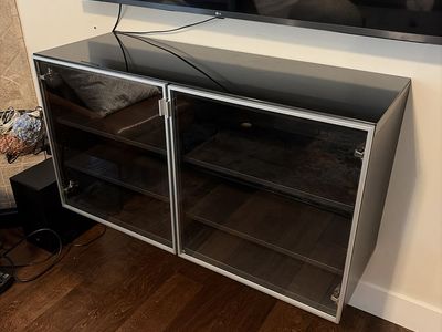 Sleek Black Glass-Top Wall-Mounted Media Cabinet with Double Doors and Adjustable Shelves