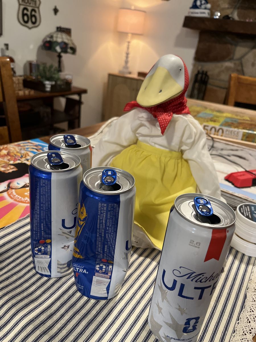 *has a drinking problem.  Goose Figurine Dressed in Outfit with Red Headscarf and Yellow Apron