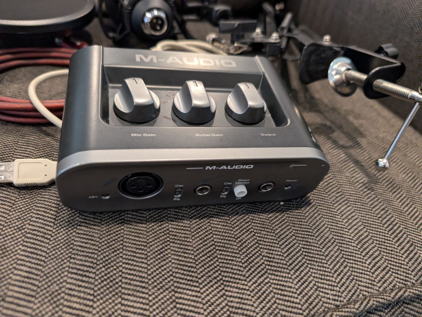 Beginner recording setup with boom arm, m-audio interface