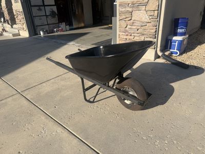 Black Steel Yard and Garden Wheelbarrow with Single Pneumatic Wheel