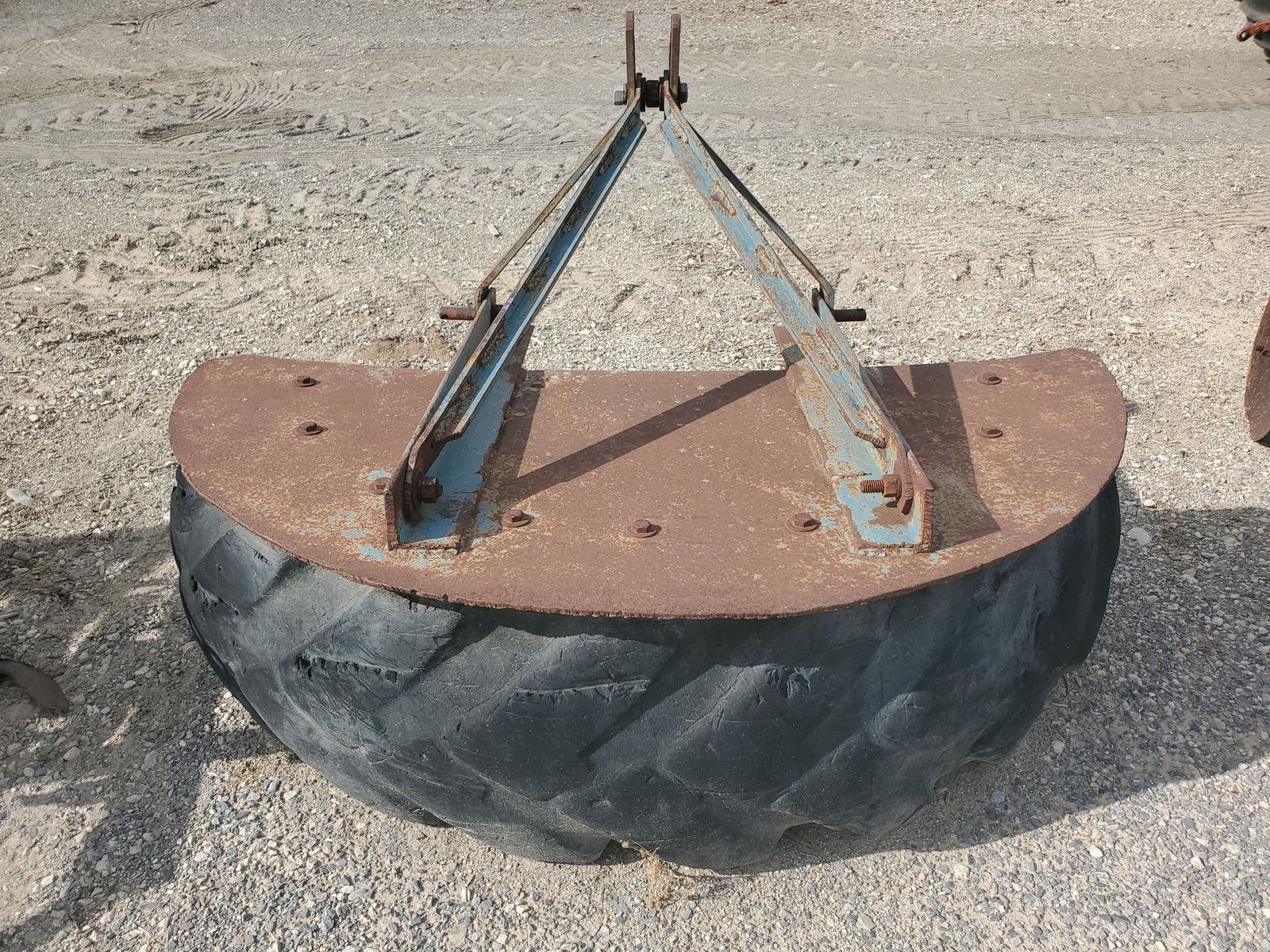 Tire tractor mount scraper